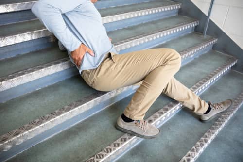 man injured after falling down the stairs and needs a Conyers Workers' Compensation Lawyer
