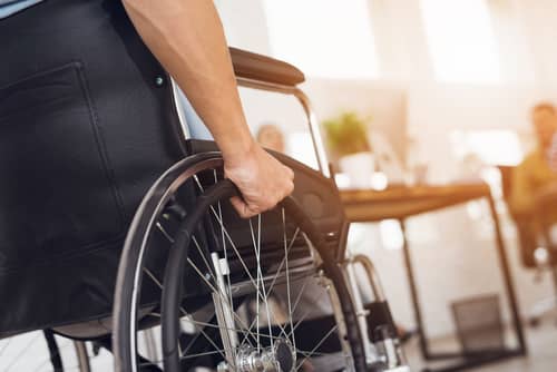 Man in a wheel chair faces workers' compensation disputes in Decatur